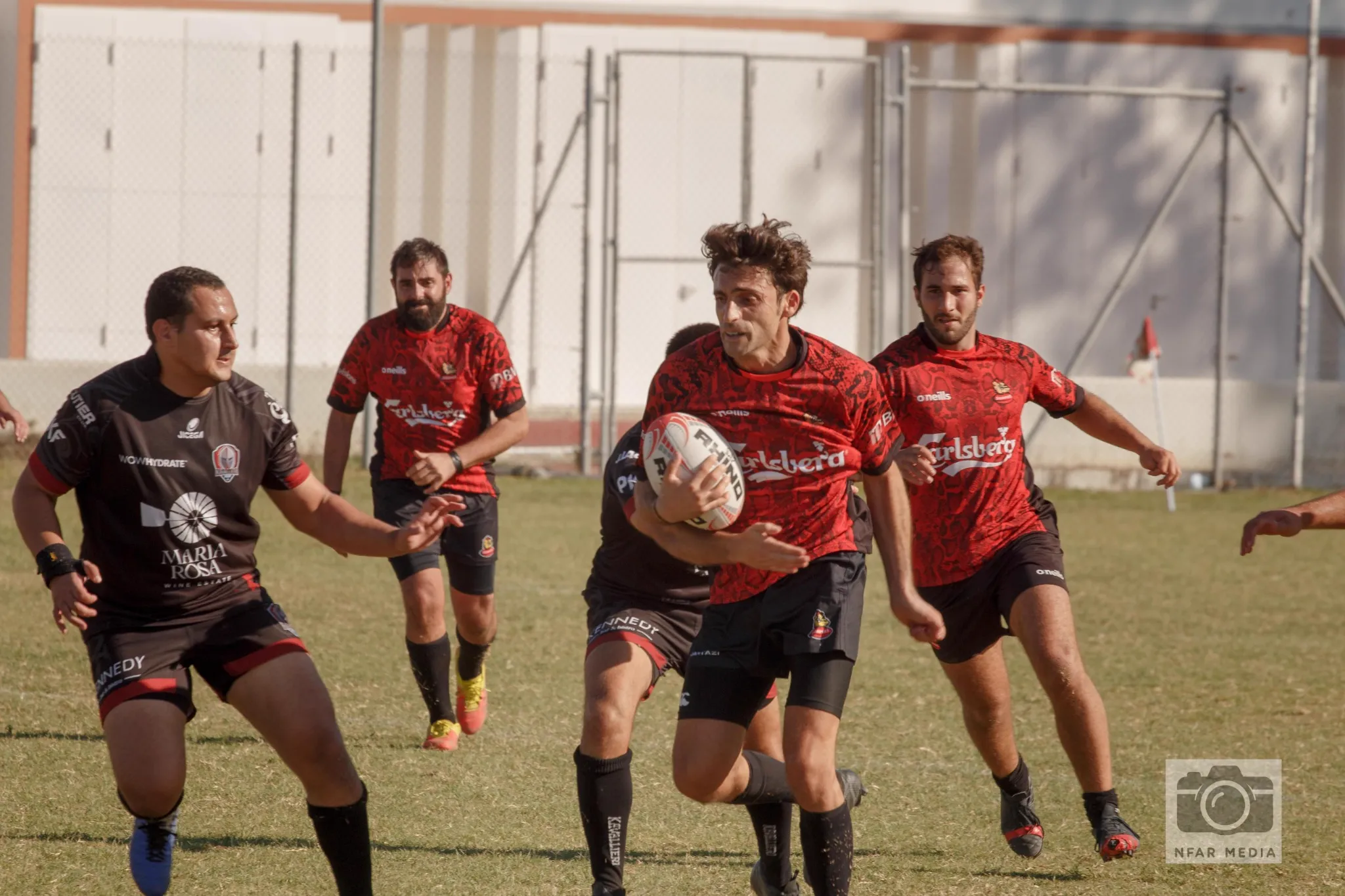 Stompers Rugby team huddle before a game