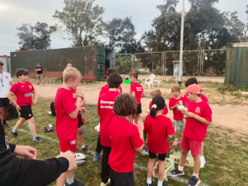 Youth Academy squad in a huddle